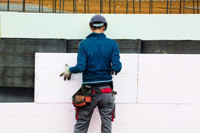 building insulation by construction workers
